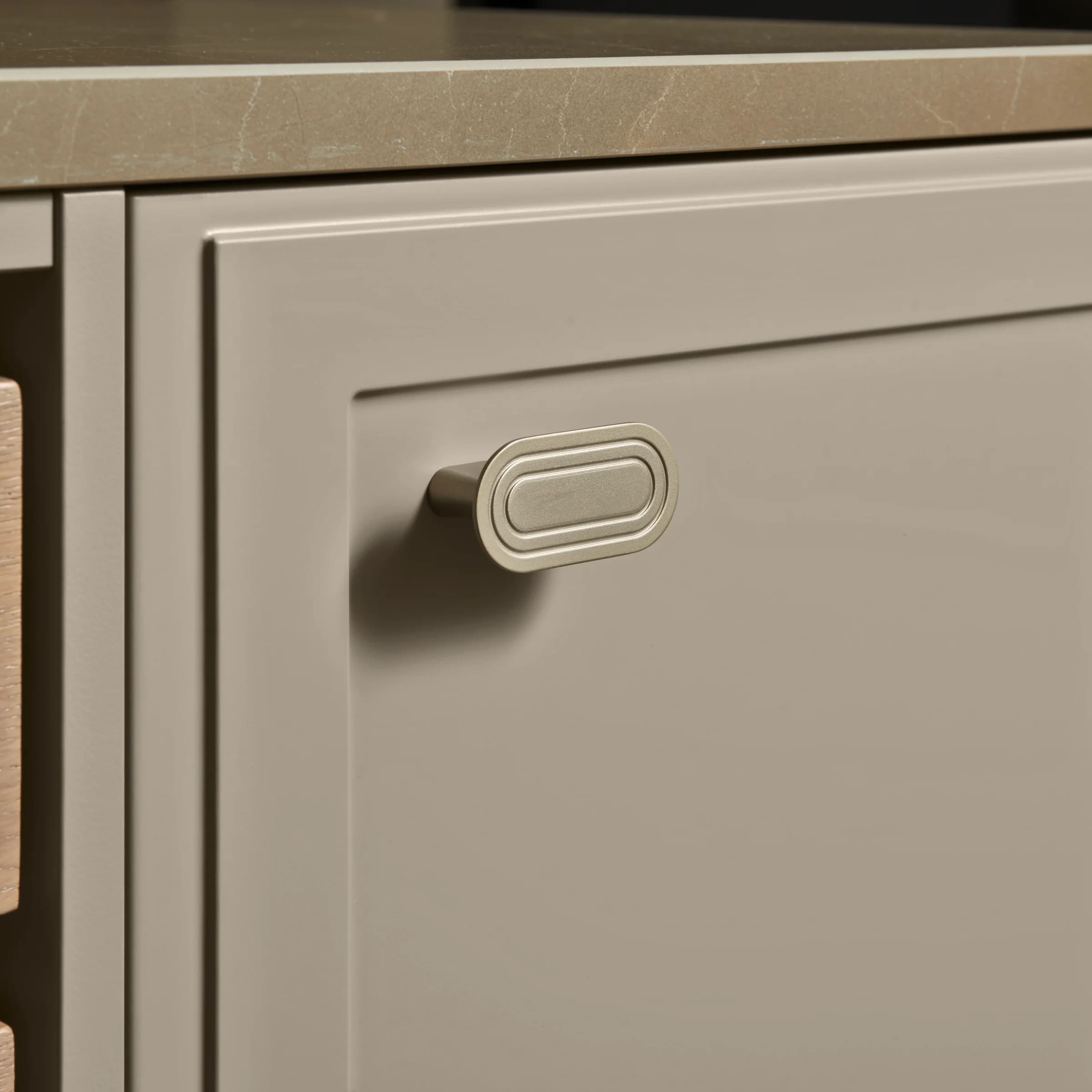 Close-up of a kitchen cabinet door with handle, part of Nolte Kitchen.